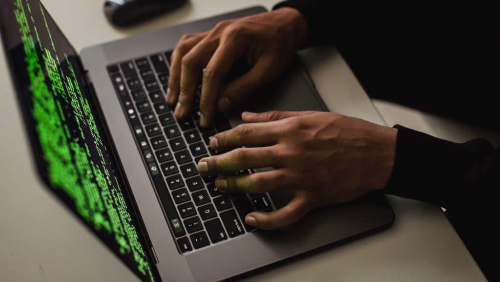 a person typing on a laptop