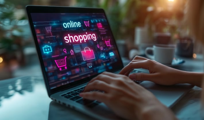 The words 'Online Shopping' are displayed on a laptop, with a background of shopping icons. It shows a buyer's experience.