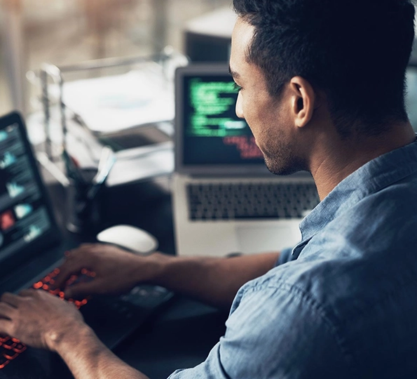 A Man Working On A Laptop.